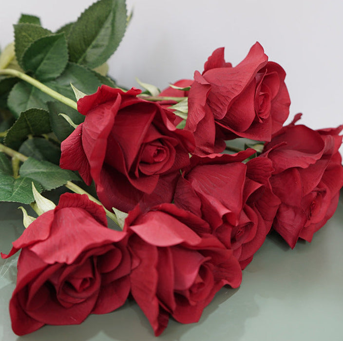 Close up soft-touch fabric petals faux classic red long stem rose 6cm bloom silk leaves