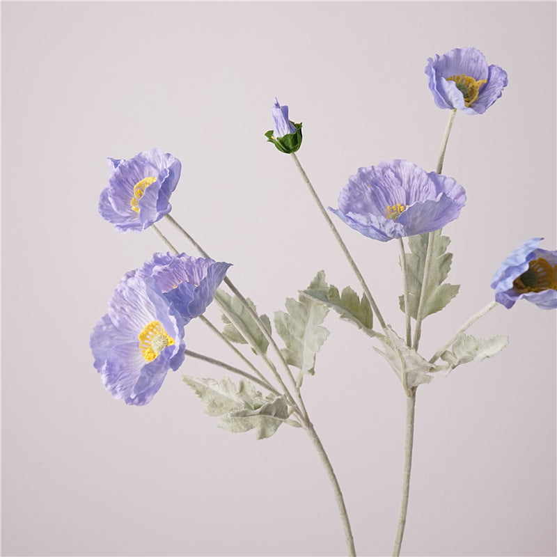 Close up real-touch fabric petals faux violet blue poppy stem